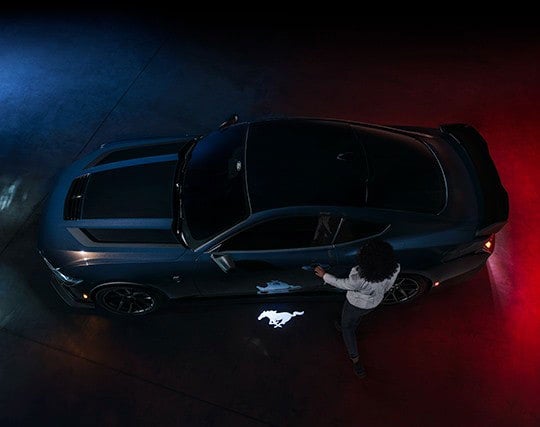 2024 Ford Mustang® Dark Horse™ model with a driver approaching the vehicle | Ed Morse Ford St. Robert in Saint Robert MO