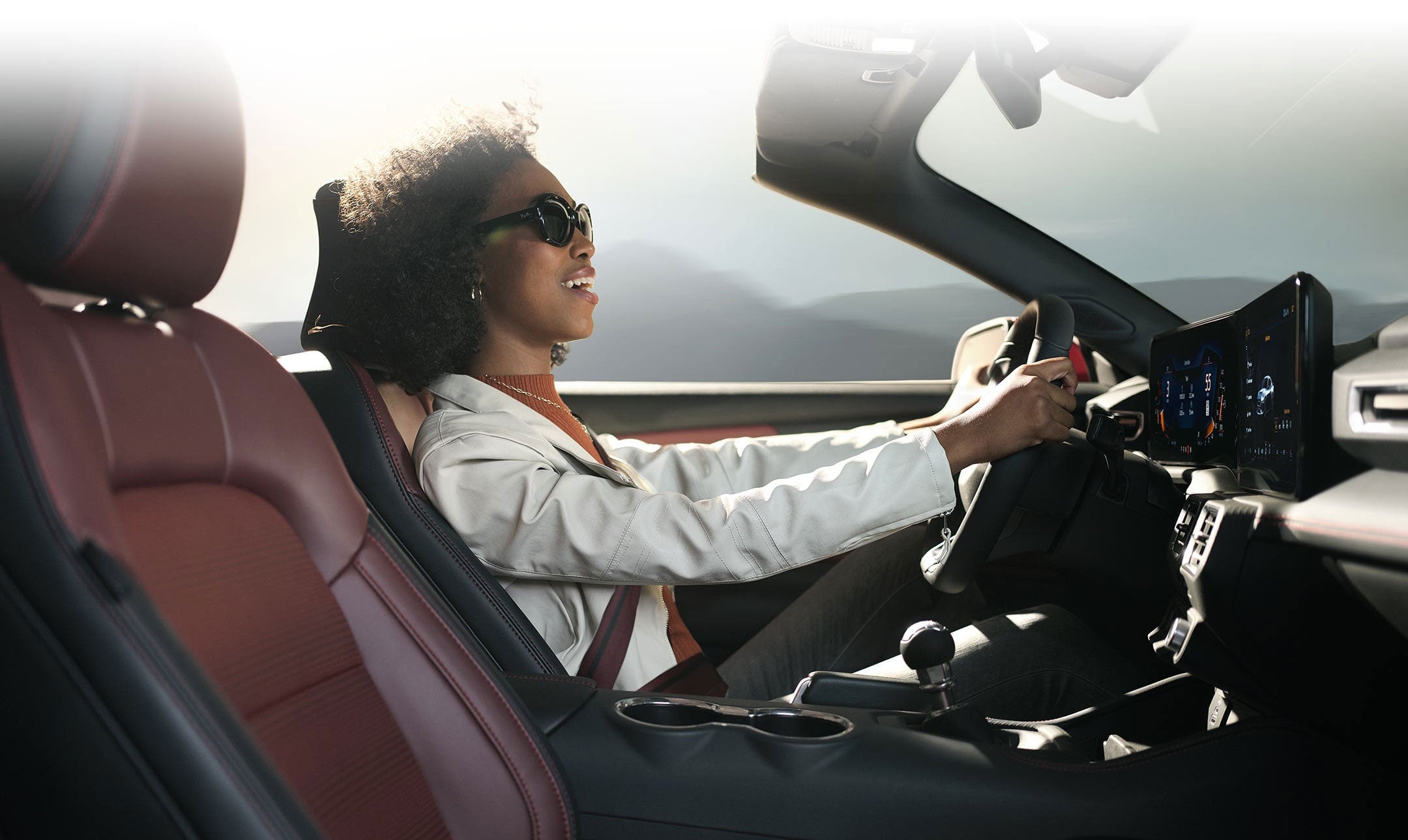 Person sitting in the driver’s seat of a 2024 Ford Mustang® convertible | Ed Morse Ford St. Robert in Saint Robert MO