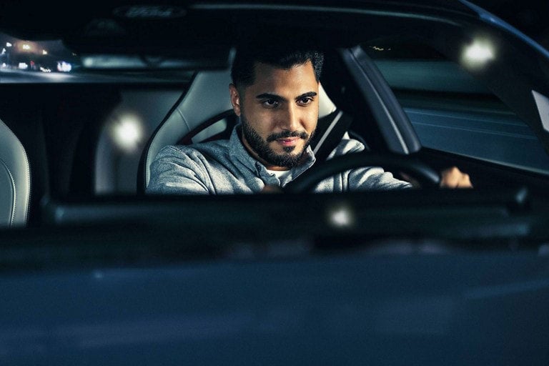 Person sitting in the driver’s seat of a parked 2024 Ford Mustang® coupe | Ed Morse Ford St. Robert in Saint Robert MO